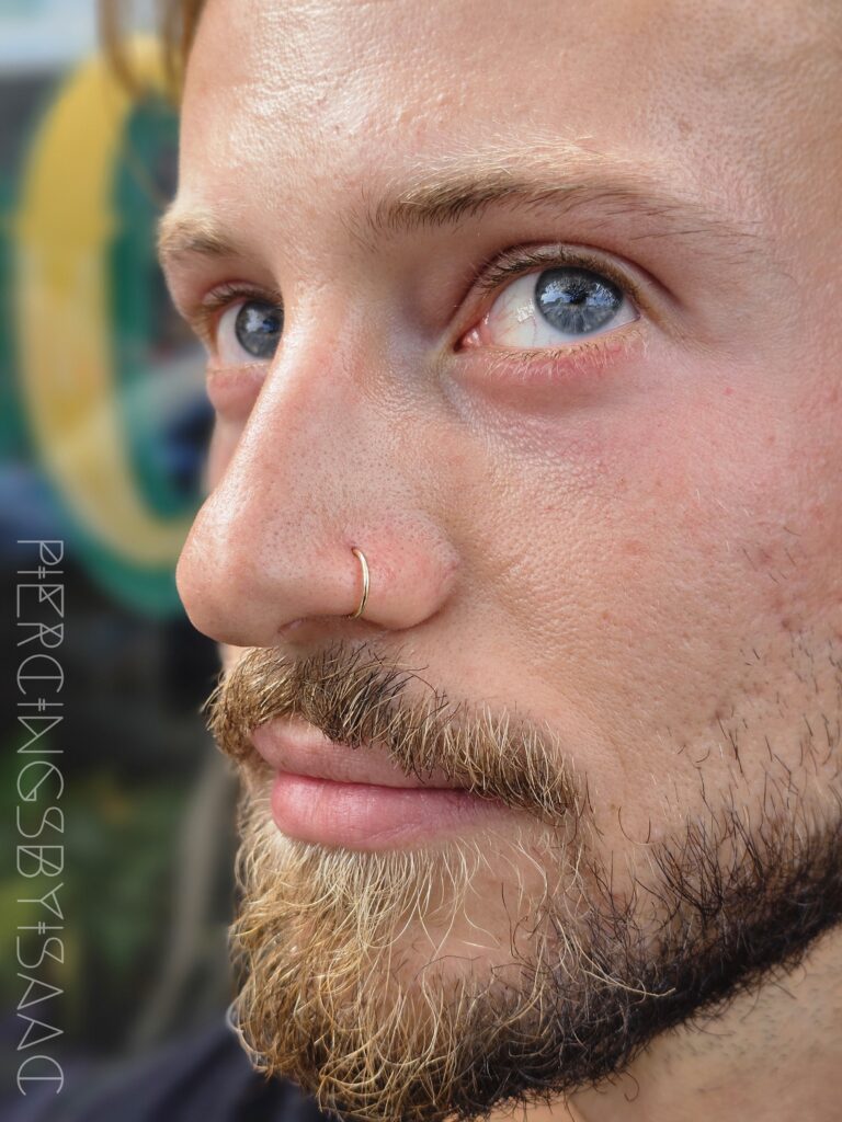 Nostril piercing on a client at Sideshow Tattoo and Piercing San Diego