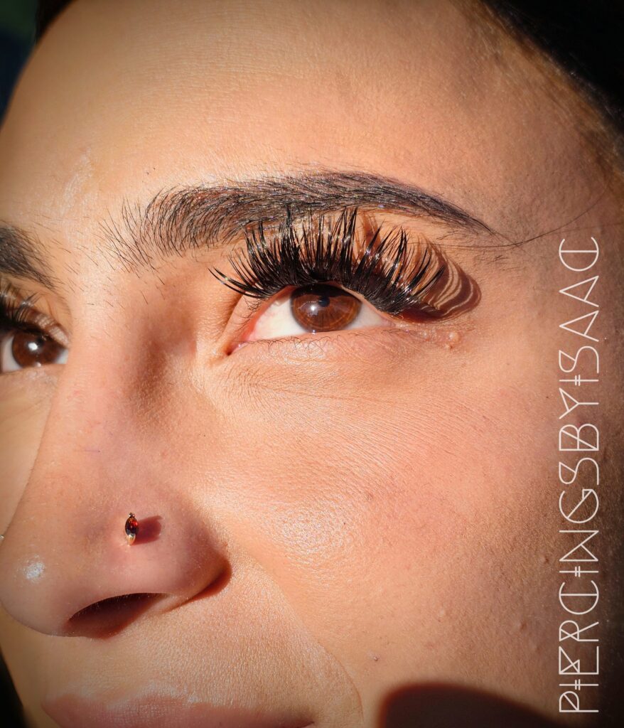 Nostril piercing with gem stud at Sideshow Tattoo and Piercing San Diego
