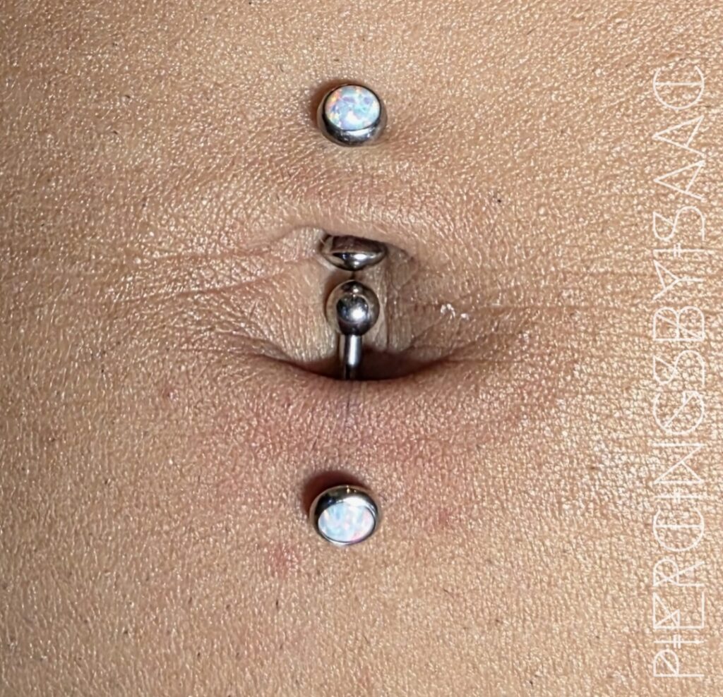 Navel piercing with opal ends at Sideshow Tattoo and Piercing San Diego