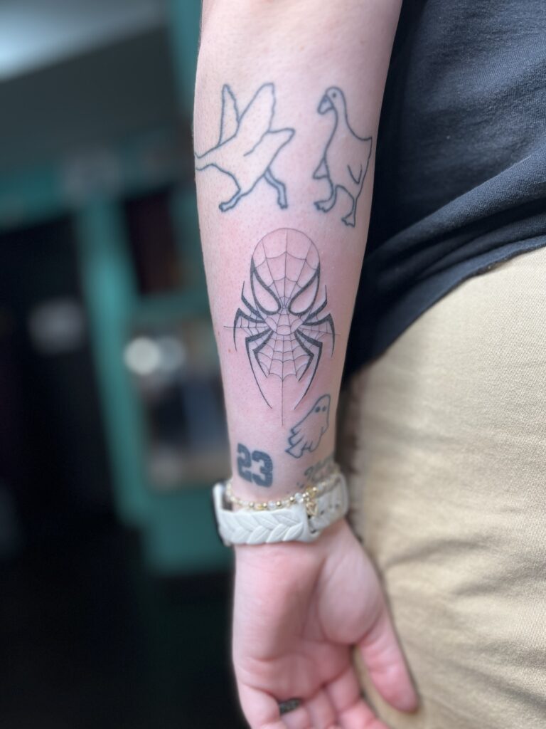 Fine line tattoo on forearm by Sideshow Tattoo and Piercing San Diego