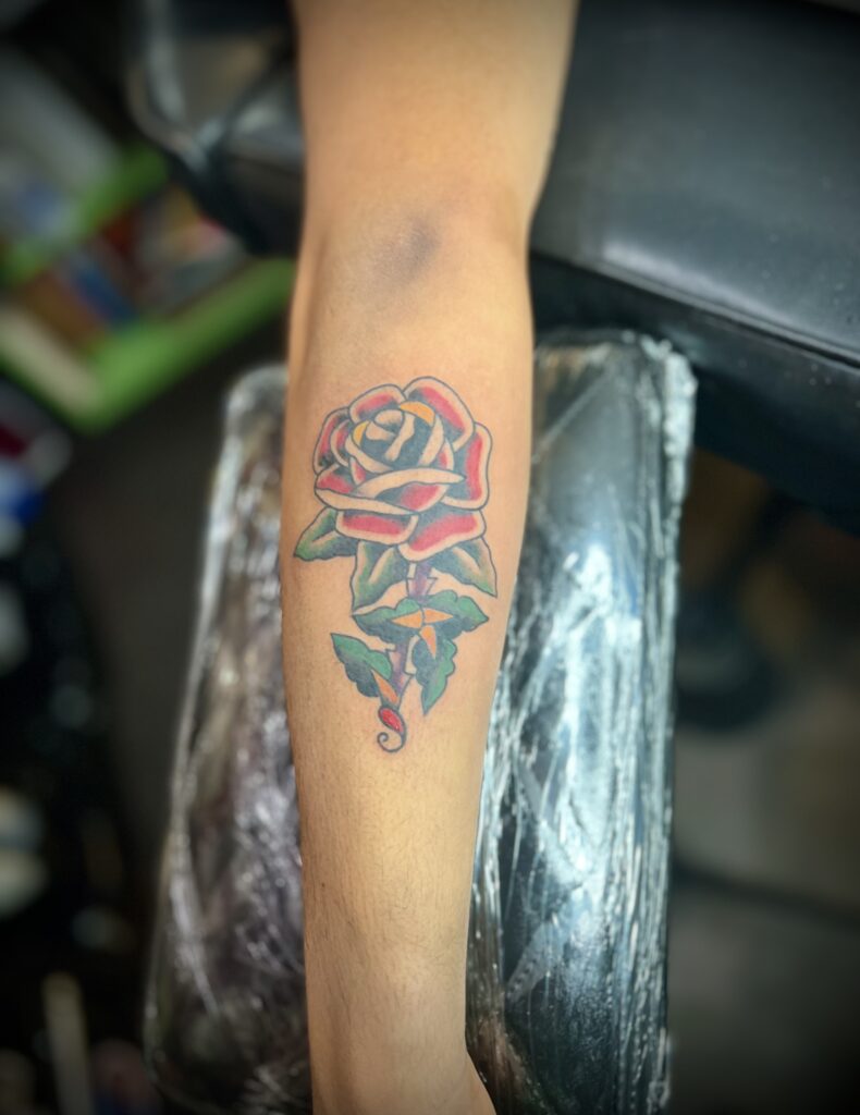 Rose forearm tattoo by Sideshow Tattoo and Piercing San Diego